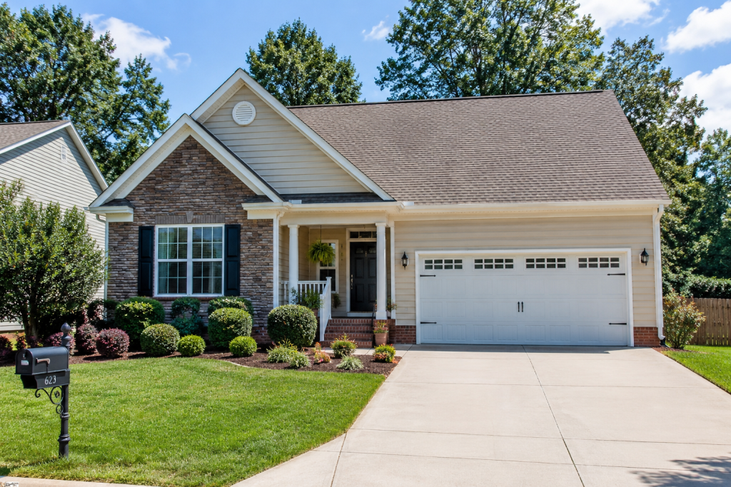 Single-family home in Asheboro, NC with a well-maintained yard and attached garage, representing homeownership costs and rising homeowners insurance challenges facing North Carolina homeowners.