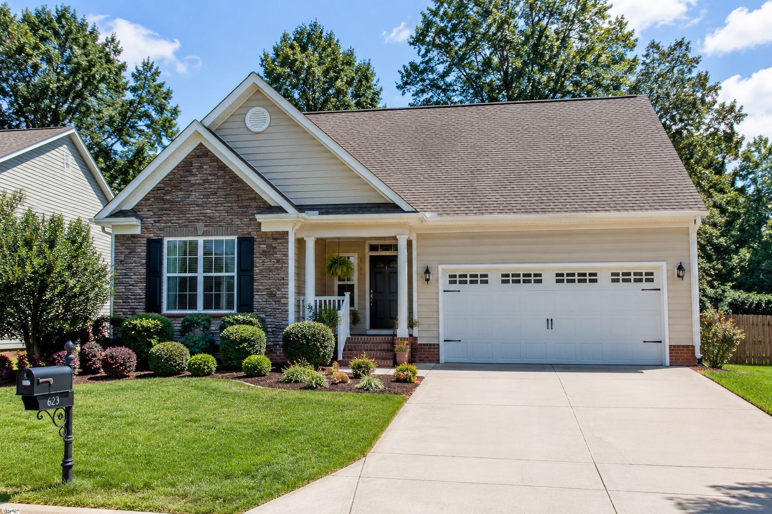 Single-family home in Asheboro, NC with a well-maintained yard and attached garage, representing homeownership costs and rising homeowners insurance challenges facing North Carolina homeowners.